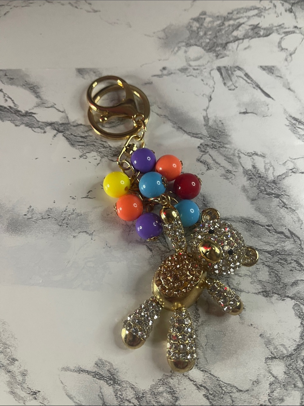 Gold toned Crystal Teddy Bear Keychain with Rainbow Beads as balloons